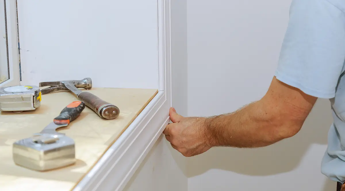 Installing wood trim around a window